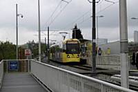Trams 3025 and 3032 working together at Freehold stop passinger service to East Didsbury on Tuesday 21st May 2013. 